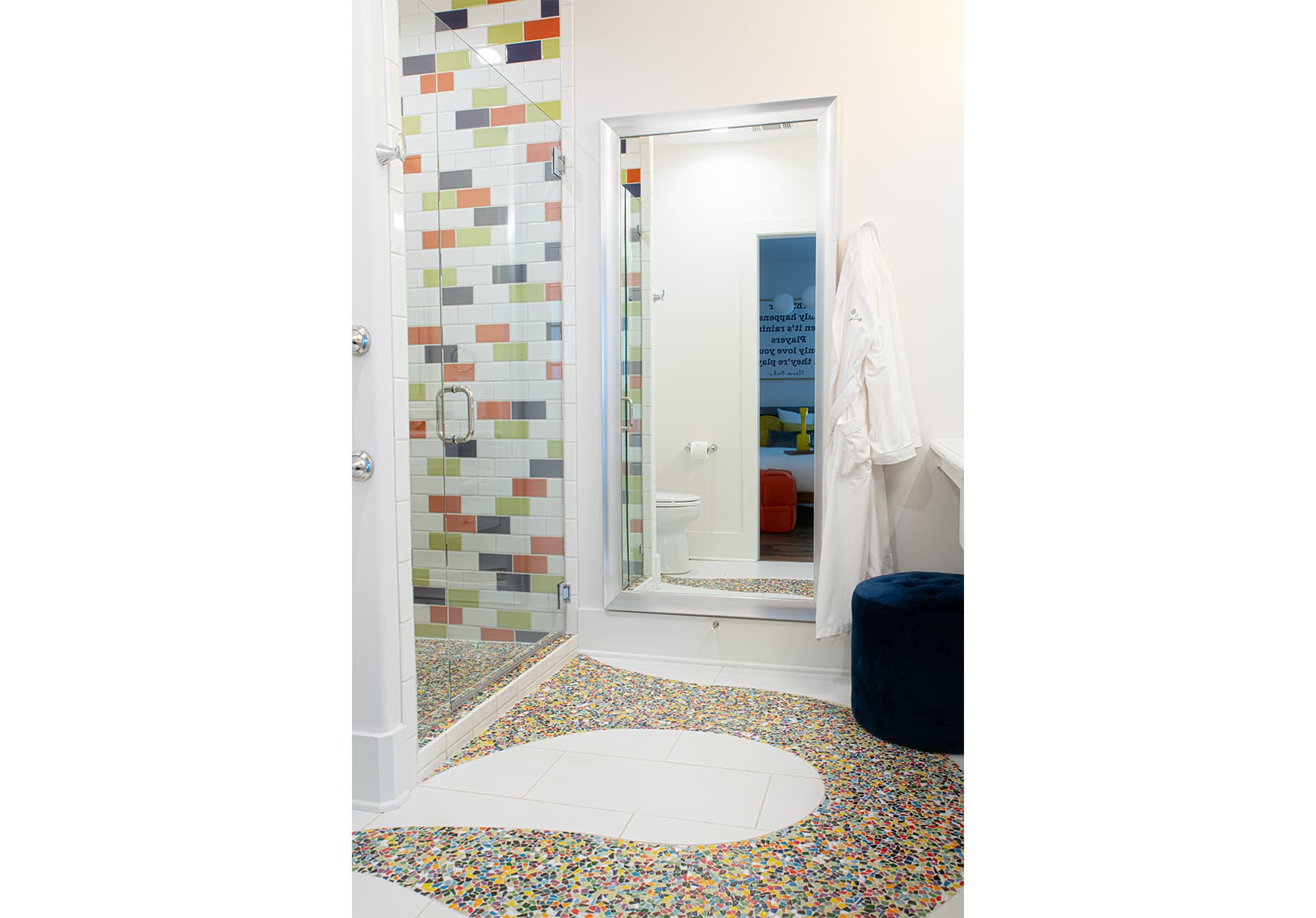 Bathroom with colorful tile inlay and a walk-in shower