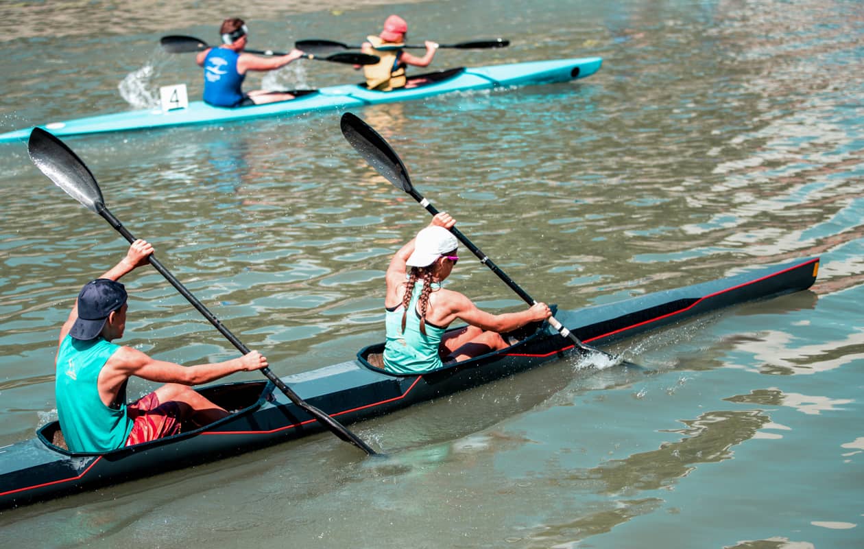 People in a competitive kayak race