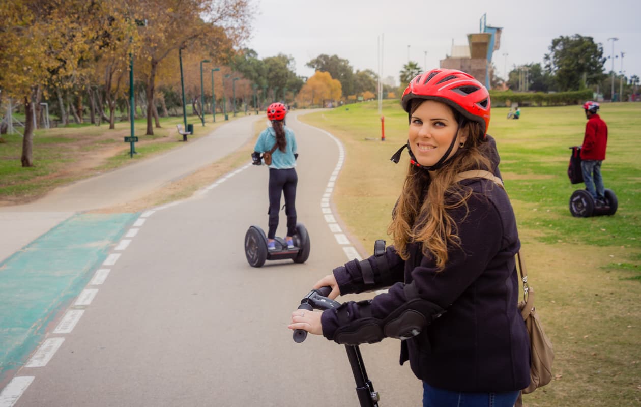 Family riding segways in a park