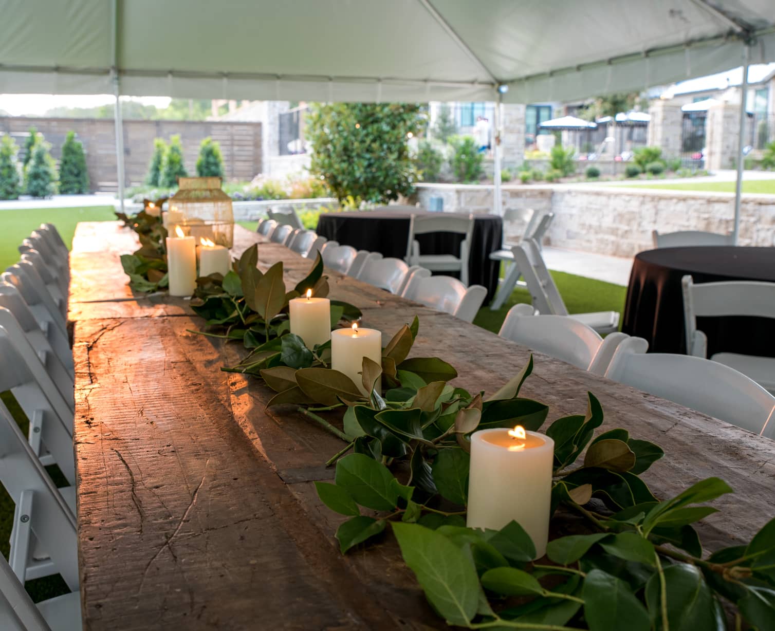 Reception table set with candles and leaves
